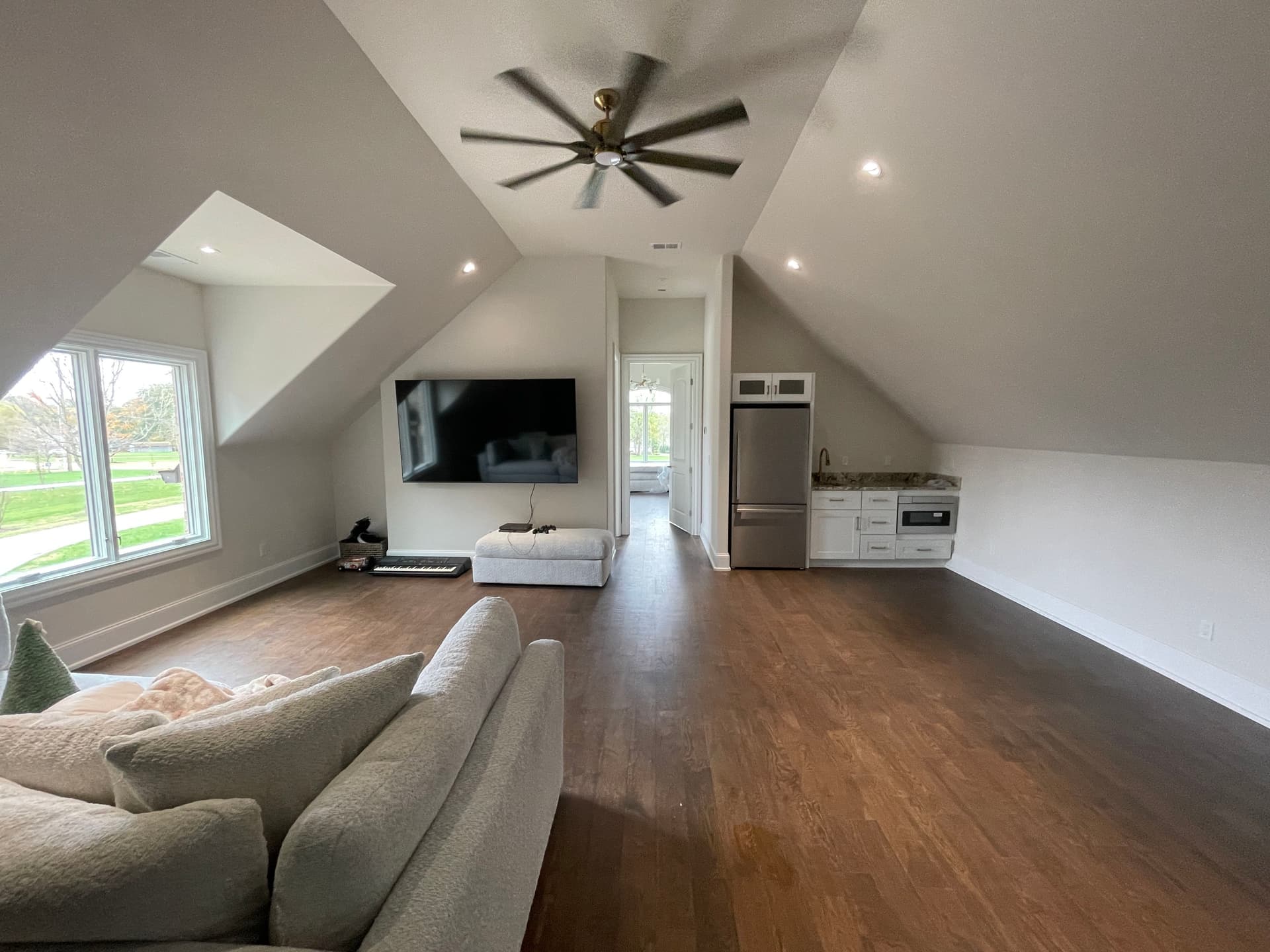 Cluttered Attic Storage Space Turned Full Living Room image