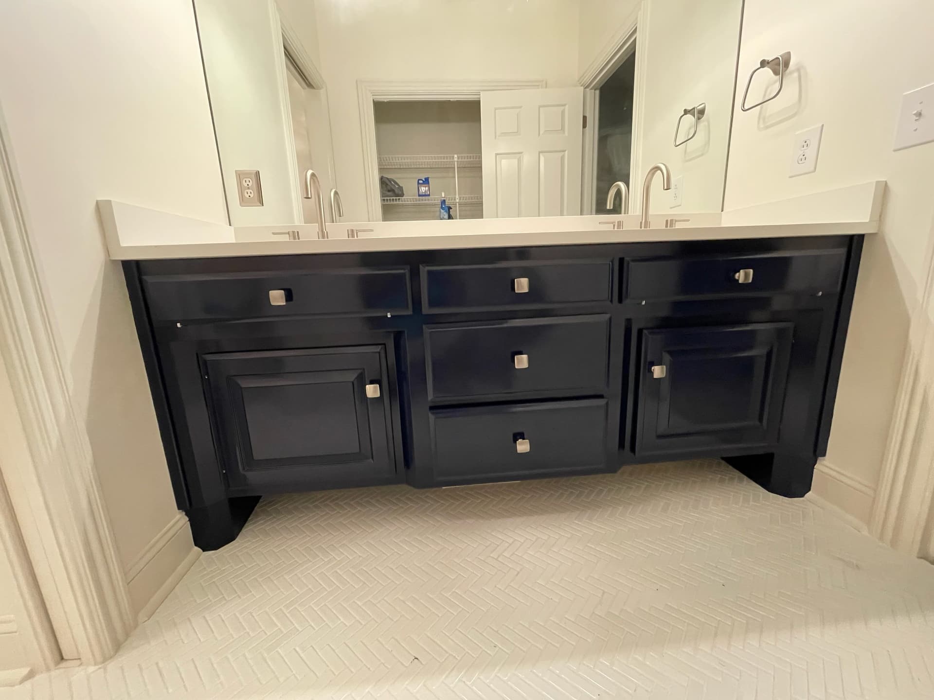 Sleek Bathroom Transformation With Herringbone Floor image