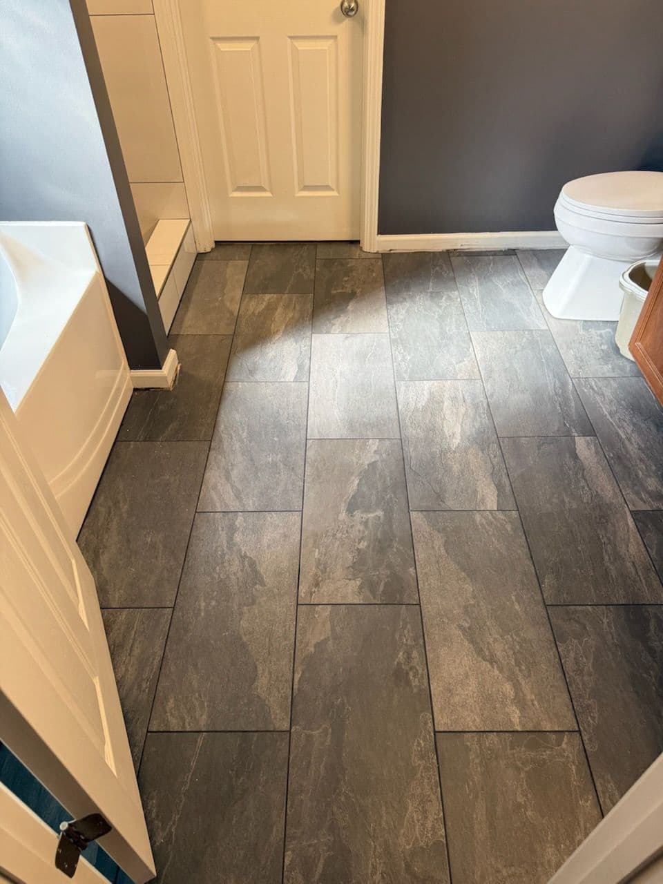 Project Sleek Bathroom Remodel with Modern White Tiles image